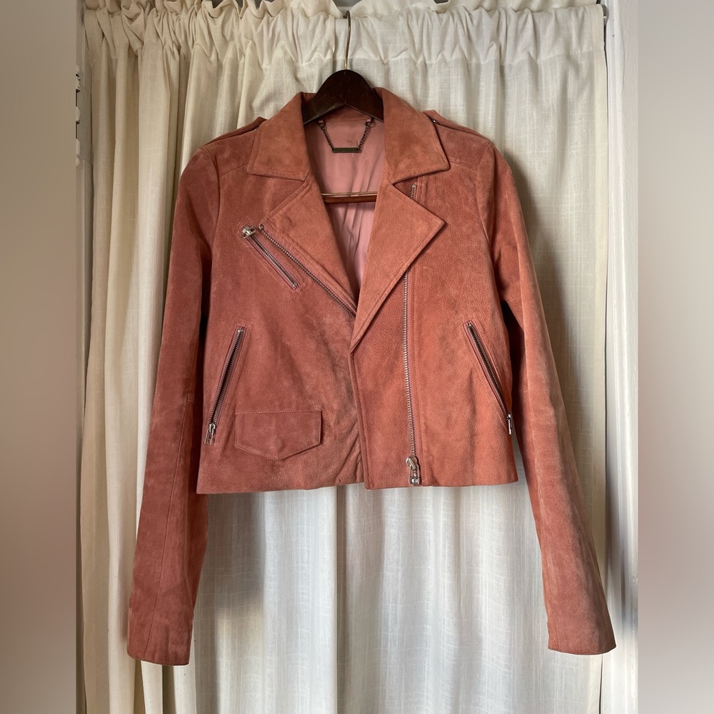 Pink 100% leather jacket. Great condition only worn a few times.